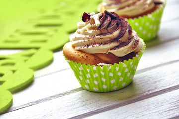 Tasty cupcakes with butter cream