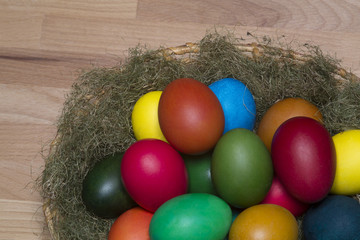 Fototapeta na wymiar Colorful eggs in the nest