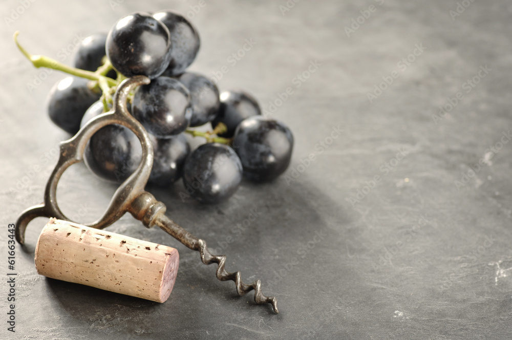 Wall mural Cork, corkscrew and red grapes