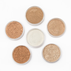Loose cosmetic powder in jars