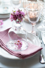 flowers in a glass bell jar