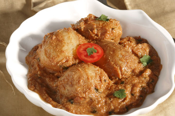 Awadhi Dum Aloo is stuffed potato cooked in silky sauce.