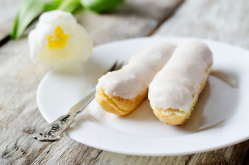 eclairs on a white plate