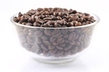 Bowl of coffee beans , isolated on white background.