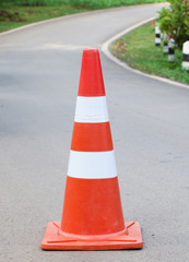 The orange traffic cone in the road