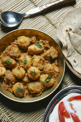 Kashmiri dum aloo is a deep fried baby potatoes cooked in yogurt