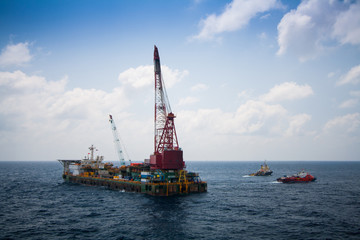 Large crane vessel installing the platform in offshore