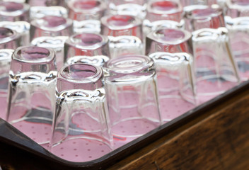 Clear glass upset on wood tray © ultramcu