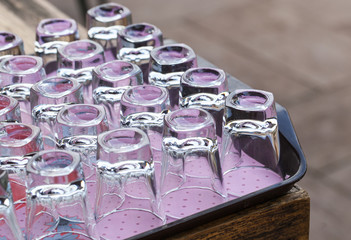 Clear glass upset on wood tray © ultramcu