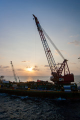 Fototapeta na wymiar Large crane vessel installing the platform in offshore