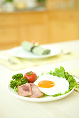 Fried egg with green leaf