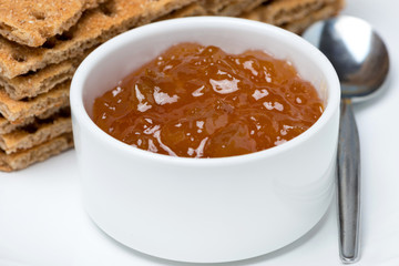 close-up of orange jam and crisp bread