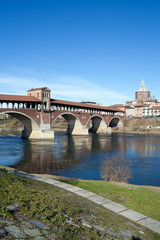 Naklejka premium Old bridge over Ticino river in Pavia, Italy
