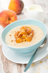 oatmeal with caramelized peaches in a bowl and jug of yogurt
