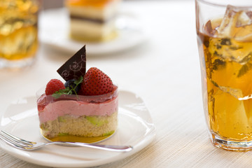 Strawberry cake and iced tea