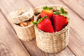 Fototapeta na wymiar Fresh strawberries in a wicker basket