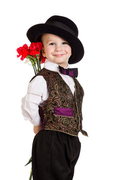 Boy in hat with a bouquet of carnations
