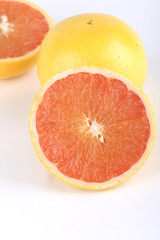 Naklejka na ściany i meble Ripe grapefruit on a white background