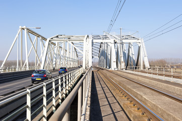 Combined railway and car bridge over river - 61687679