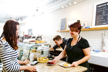Clerk serving coffee