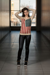Obraz na płótnie Canvas Model Wearing Leather Pants And American Flag Shirt