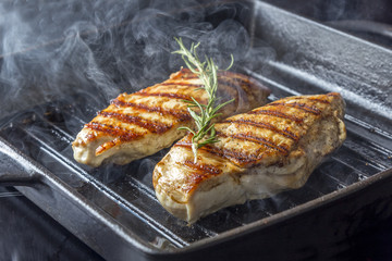 Chicken Breast with rosemary in pan
