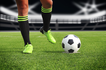 soccer ball on the football field in stadium at night