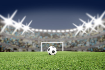 soccer ball on the football field in stadium at night