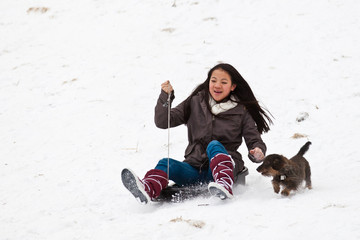 Fototapeta na wymiar Girl sledging