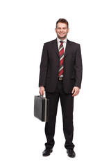 smiling and relaxed businessman with briefcase
