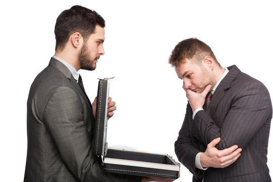 businessman showing briefcase