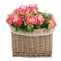 Bouquet from artificial roses  in wicker basket isolated on whit
