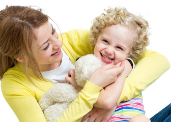mother and kid girl having fun