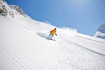 Skier in deep powder, extreme freeride