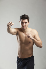 Fototapeta premium half naked man lifting weights