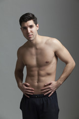 Fototapeta premium half naked man lifting weights