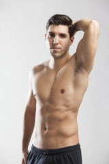 Fototapeta premium half naked man lifting weights