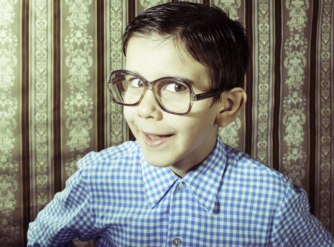 Smiling child with glasses in vintage clothes