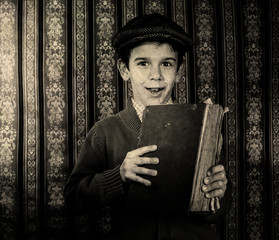 Child with red vintage book