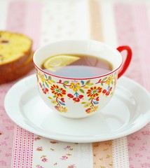 orange cake with cup of tea