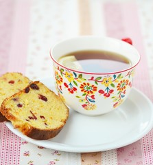 orange cake with cup of tea