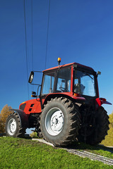 Modern red tractor outdoors
