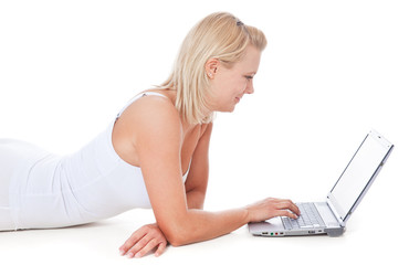 Attractive young woman in underwear using laptop