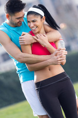 Young couple in the park after exercise