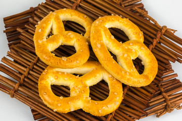salted pretzels in a bowl on wooden table cloths