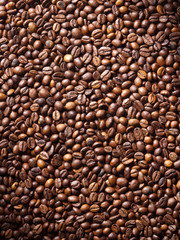Numerous coffee beans which have been scattered all over the sur