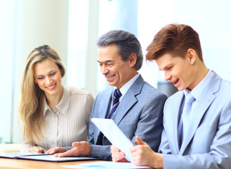 Business team interviewing young applicant