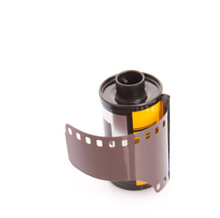 Fototapeta na wymiar 35mm still camera film cartridge over white background