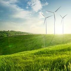Zelfklevend Fotobehang Wind generators turbines on sunset summer landscape © artjazz