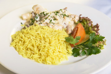 liver in sour cream sauce with rice and vegetables